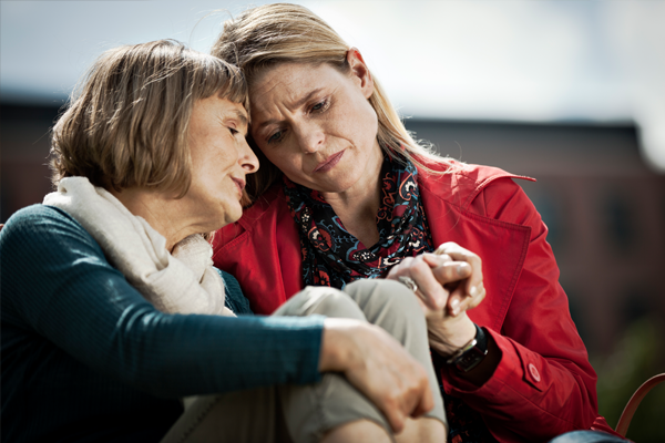 mother and daughter consoling each other