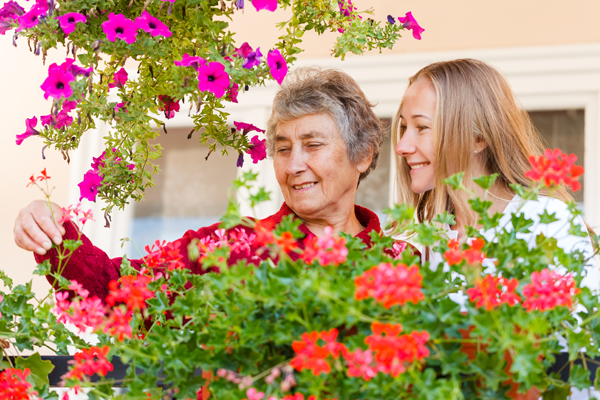 grandmother and granddaughter outside with the flowers